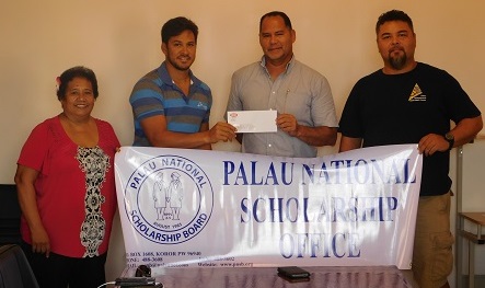 Delegate and IP&E Palau Area Manager Frank Kyota Presents a Check of $5,000 to PNSB